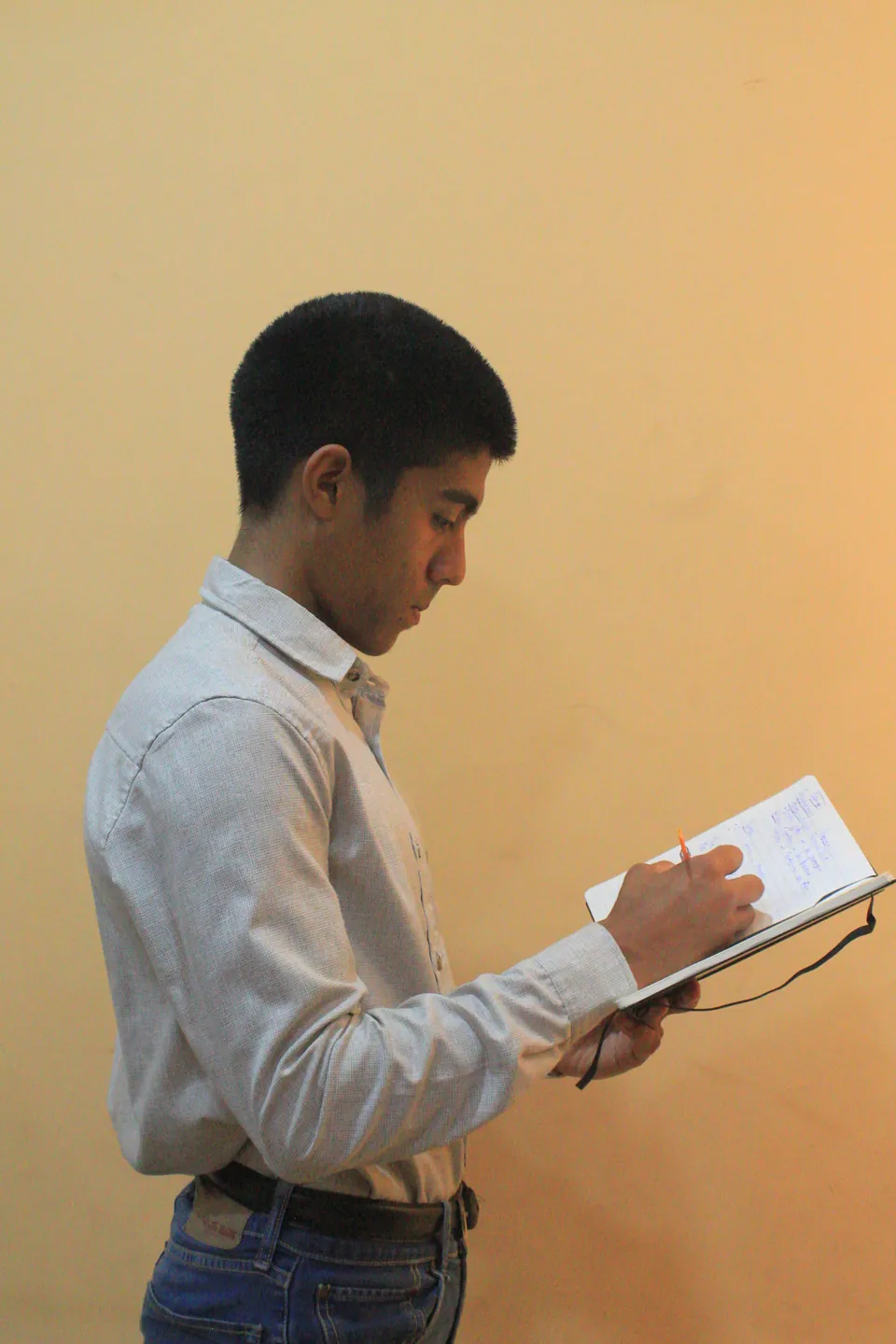 Joaquín Caballero taking notes standing up